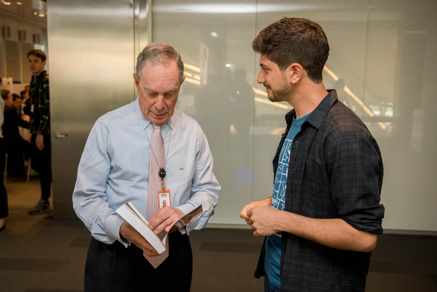 Jon Wexler showing his book to Mike Bloomberg
